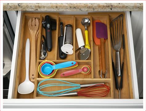 Stick on a plastic caddy for things like meat thermometers. How to Organize Kitchen Cabinets in 10 Steps with Pictures