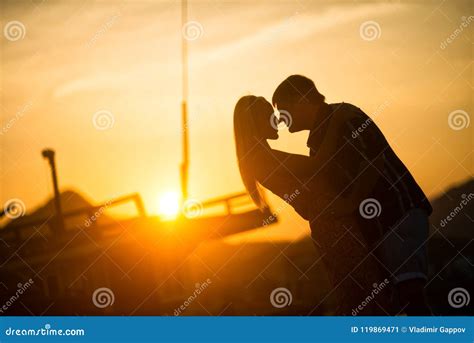 Man And Woman Kissing At Sunset Silhouette Photo Stock Image Image Of Clouds Person