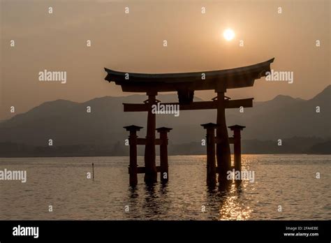 Scenic View At Sunset Of The Famous Floating Torii Gate At Itsukushima