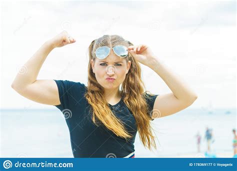 Woman In Sunglasses Showing Muscles Stock Image Image Of Summer Showing 178369177