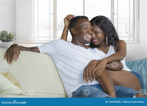 Young Beautiful And Happy Black African American Couple In Love Relaxed At Modern Home Living