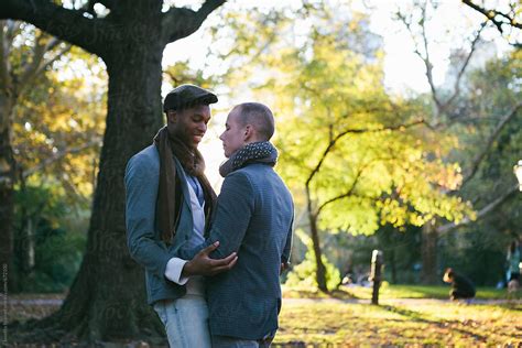 Young Gay Couple In Intimate Moments In New York Central Park At