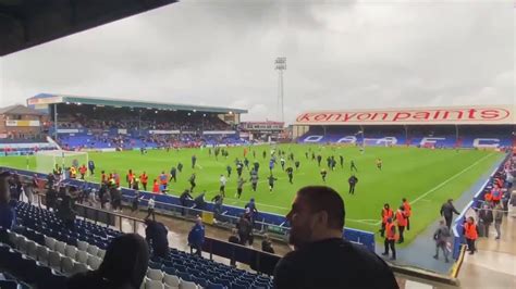 Oldham Athletic Fans Invade The Pitch In Protest Against Owner Abdallah Lemsagam