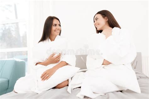 Girls Have A Great Time At The Hen Party Brunettes In White Bathrobes Have Fun In A Bright Room