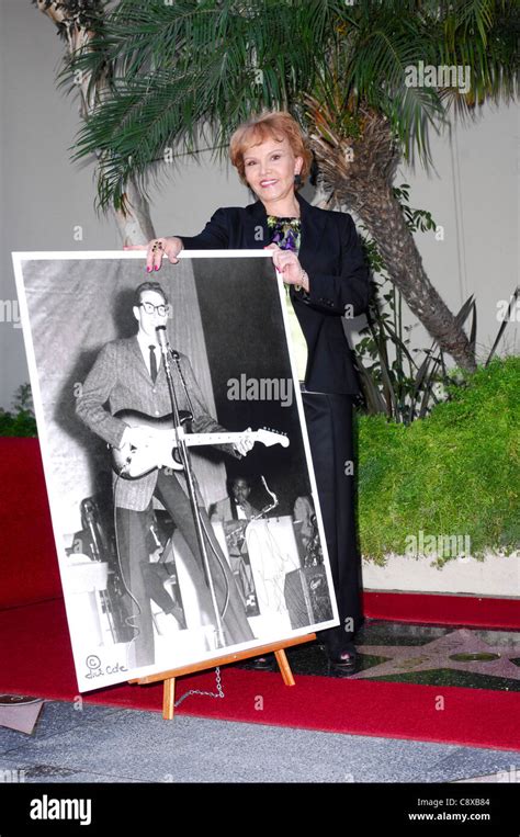 Maria Elena Holly With Picture Of Buddy Holly At The Induction