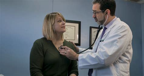 Male Doctor Using Stethoscope To Listen To Stock Footage Sbv 332582831