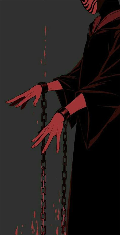 A Man In A Black Robe And Red Gloves Is Chained To Chains With His Hands