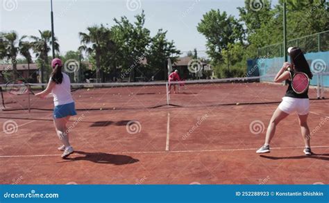 Turkey Antalya Two Women Train To Hit Tennis Balls On The Court With A Coach Stock