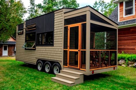 This stylish 400 square foot tiny home has an open concept floor plan, one bedroom, and one bathroom. 25 foot Tiny House on wheels with screened in porch