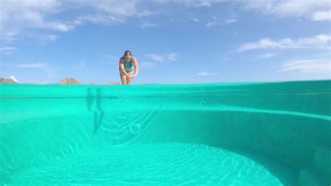 Young Woman In Bikini Falls Off Floating Airbed Raft Mattress In