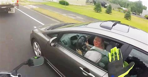 Rude Driver Gets Instant Karma After Trying To Push Motorcycle Into Oncoming Traffic