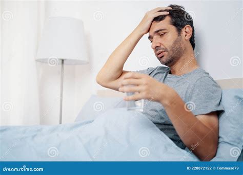 One Man Feeling Fever Symptoms And Suffering In Bed Stock Photo Image