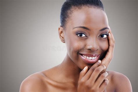 The Perfect Face With The Perfect Smile Portrait Of A Beautiful African American Woman Touching