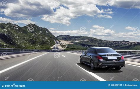 Car Drives Fast On A Highway In The Highlands Stock Image Image Of