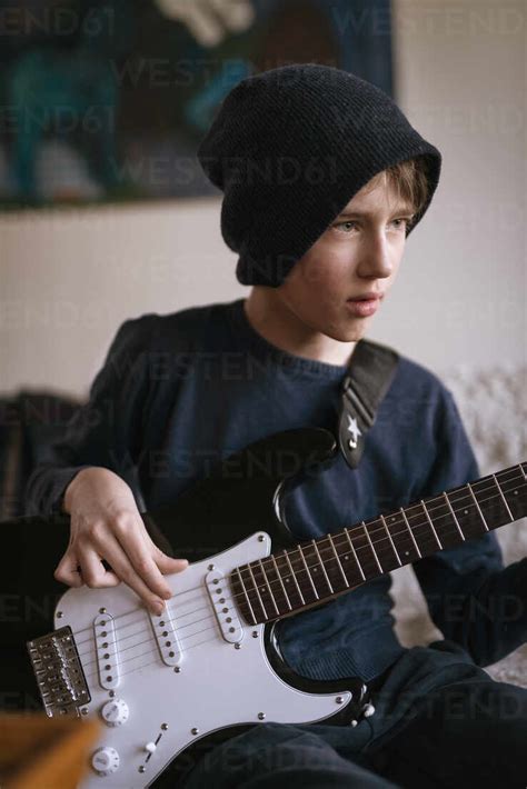 Boy Playing Guitar Stock Photo