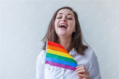 premium photo caucasian lesbian girl with lgbt rainbow flag isolated on white background