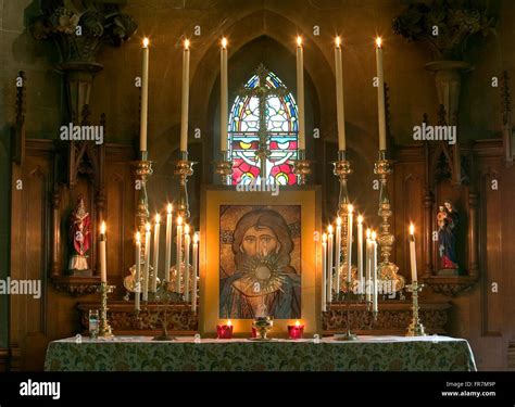 The Altar Of A High Church Anglican Church With Candles And A Picture