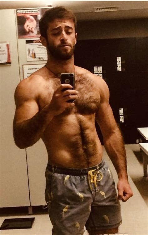 A Shirtless Man Taking A Selfie In Front Of A Mirror With His Cell Phone
