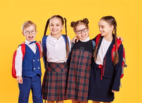 Funny Group Children Student Boy And Girls About Yellow Background