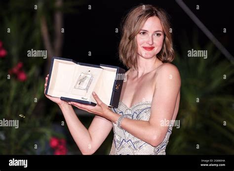 cannes july 17 renate reinsve poses with best actress award at the photocall the palme d or