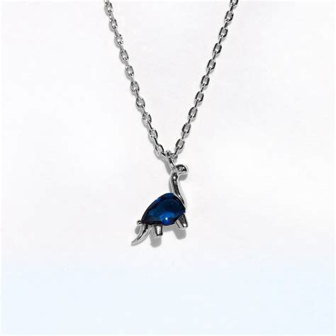You'll reach new heights when you wear our Longneck Dino Necklace! This