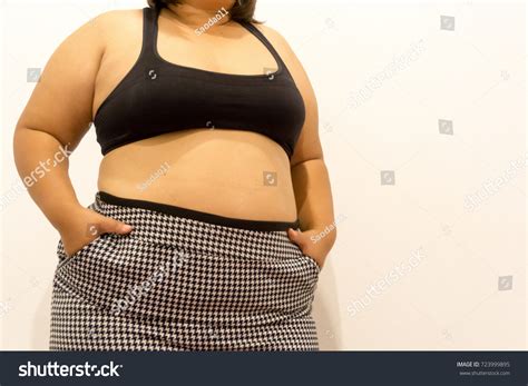 Overweight Woman Trying Fasten Her Skirt Stock Photo 723999895