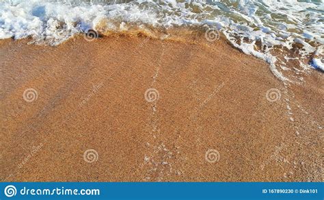 Sandy Beach Background With White Foam Of Sea Wave Stock Photo Image