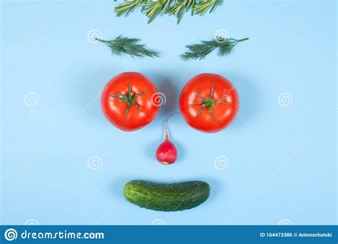 Funny Face From Different Vegetables Tomatoes Cucumber Radish Dill