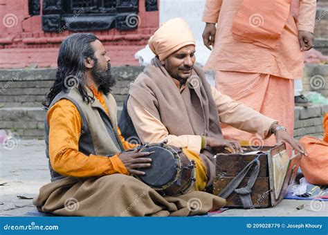 hindu sadhus playing music oudoor in pashupatinath during maha shivaratri festival kathmandu