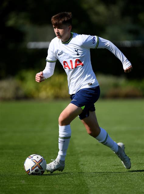 mickey moore puts pen to paper on new tottenham deal