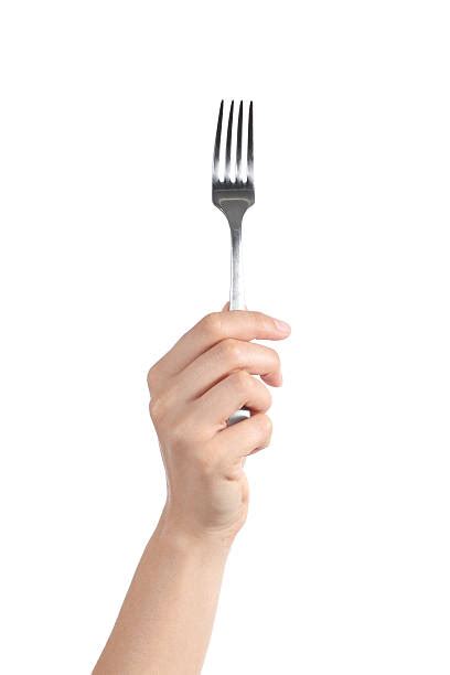 Holding Fork Stock Photos Pictures And Royalty Free Images Istock