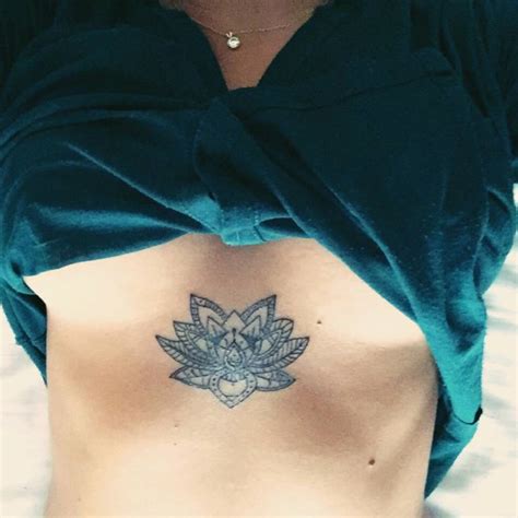 Sternum Tattoo Of A Lotus Flower On Sara Barrefer