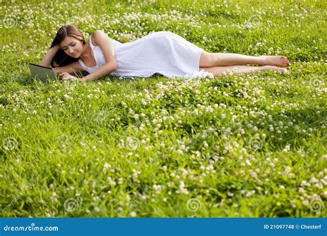 Woman Laying On Grass Stock Photography 21097748