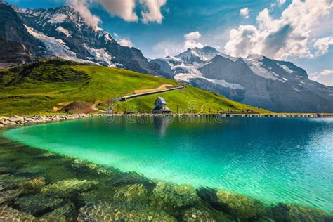 Turquoise Lake And High Mountains With Glaciers Bernese Oberland