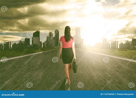 Success Business Woman Walk Towards The Light Heading To The City Stock