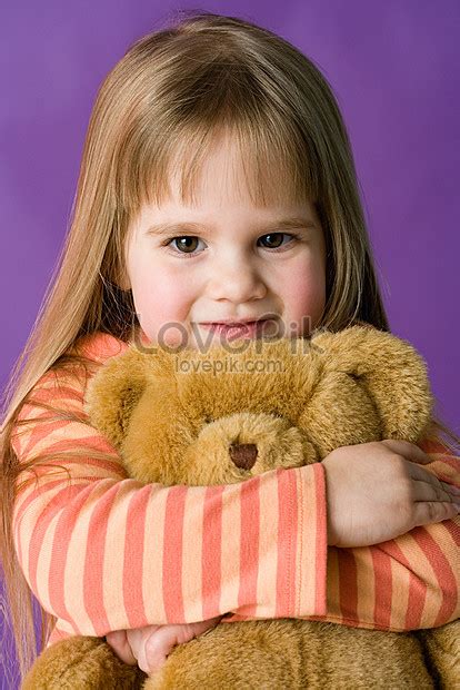 girl hugging a teddy bear picture and hd photos free download on lovepik