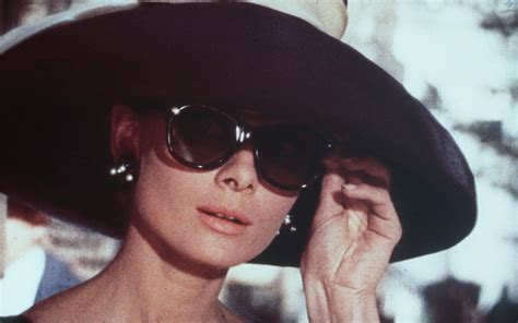 Audrey Hepburn In Wearing Her Signature Cat Eye Sunglasses In Breakfast At Tiffanys Audrey