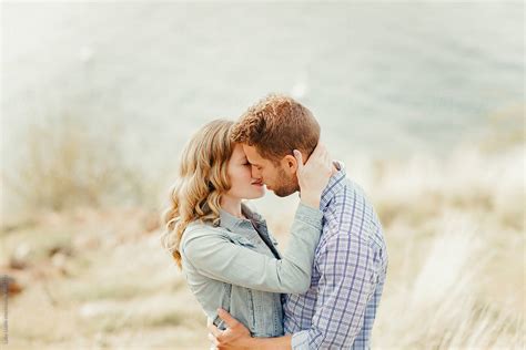 Young Attractive Couple Kissing By Stocksy Contributor Luke Liable Stocksy