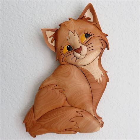 A Wood Carving Of A Cat On The Wall
