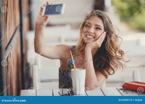 Young Woman Taking A Selfie In A Cafe Stock Image Image Of Fall Fashion 64349775