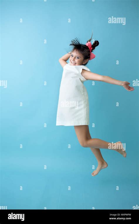 Happy Kid Jumping High Stock Photo Alamy