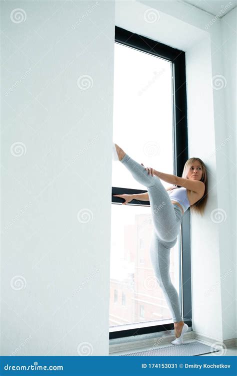 Beautiful Athletic Woman Doing Stretching Legs Near Window Stock Image Image Of Girl