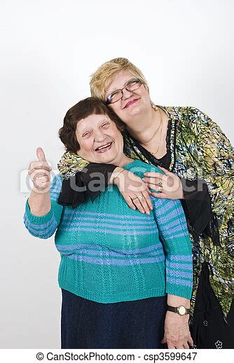 Senior Mother With Her Mature Daughter Mature Daughter Embrace Her