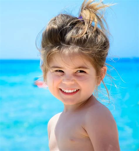 Girl Smiling On Beach Stock Photo By ©uncleraf 63082807