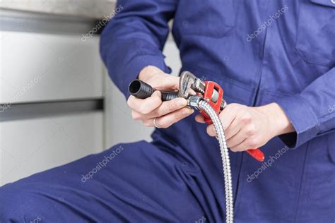 Plumber Fixing The Pipe — Stock Photo © Implementar 86708860