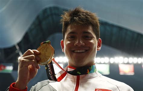Some weightlifters dream of joining t. Swimmer Schooling seeks national service delay after ...