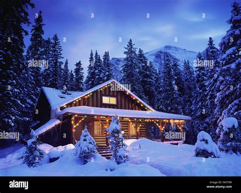 Cabin In Snow Christmas Lights High Resolution Stock Photography And