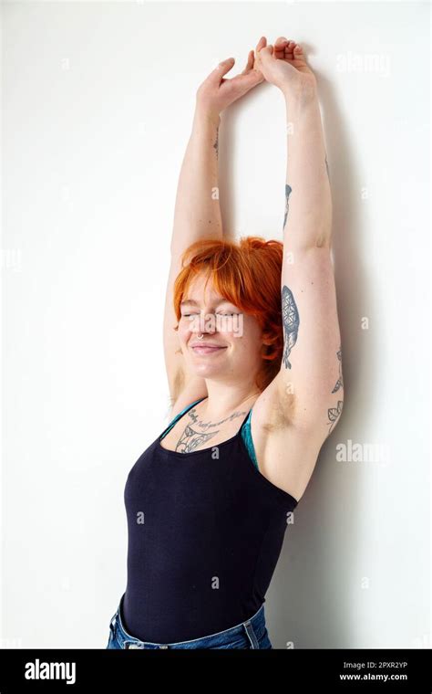 A Beautiful Woman In Her Mid Twenties With Tattoos And Unshaved Armpits