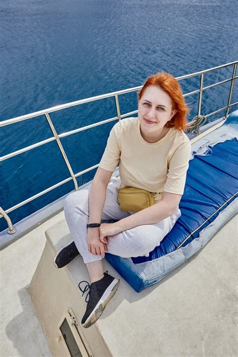 Pretty European Woman Poses For Photographer On Board Yacht For