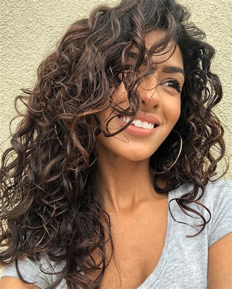 12 Sensational Long Naturally Curly Hairstyles With Bangs